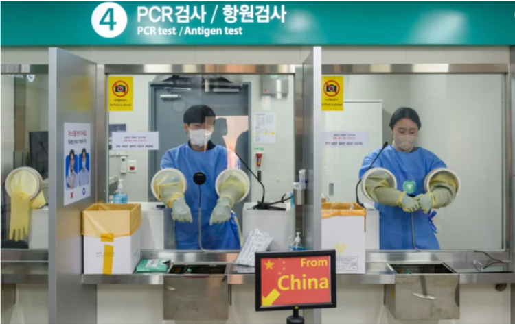 <strong>Quarantine officials seen preparing for a PCR test for travelers arriving from China in COVID-19 testing station at Incheon International Airport, west of Seoul, on January 2, 2023. South Korea started requiring COVID-19 testing for arrivals from China at Incheon International Airport, the gateway to South Korea. Kim Jae-Hwan–SOPA Images/LightRocket/Getty Images</strong><br>
